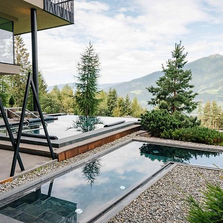 Hotel My Arbor - Dolomites Bressanone Esterno foto A private swimming pool in the Alps