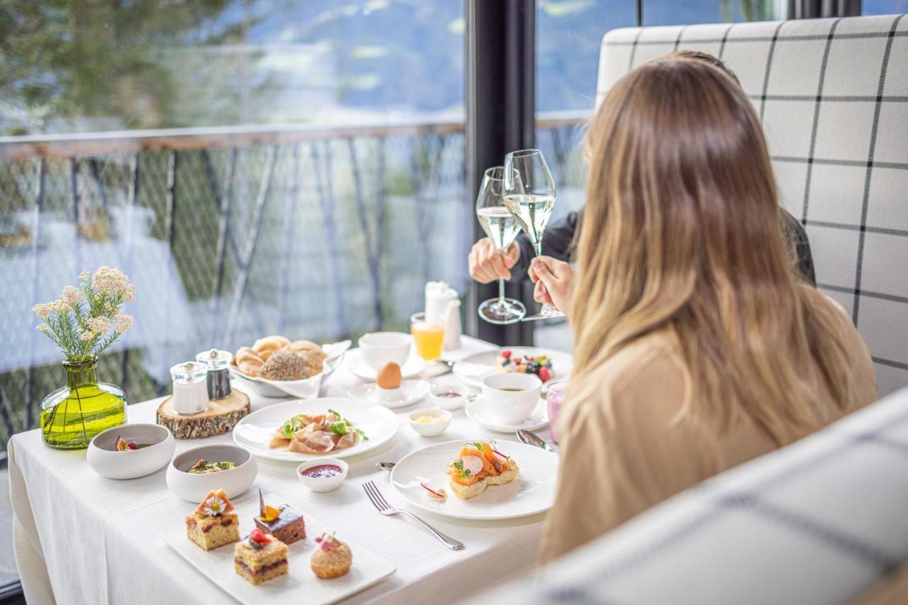 Hotel My Arbor - Dolomites Bressanone Esterno foto A woman enjoying a meal at a restaurant