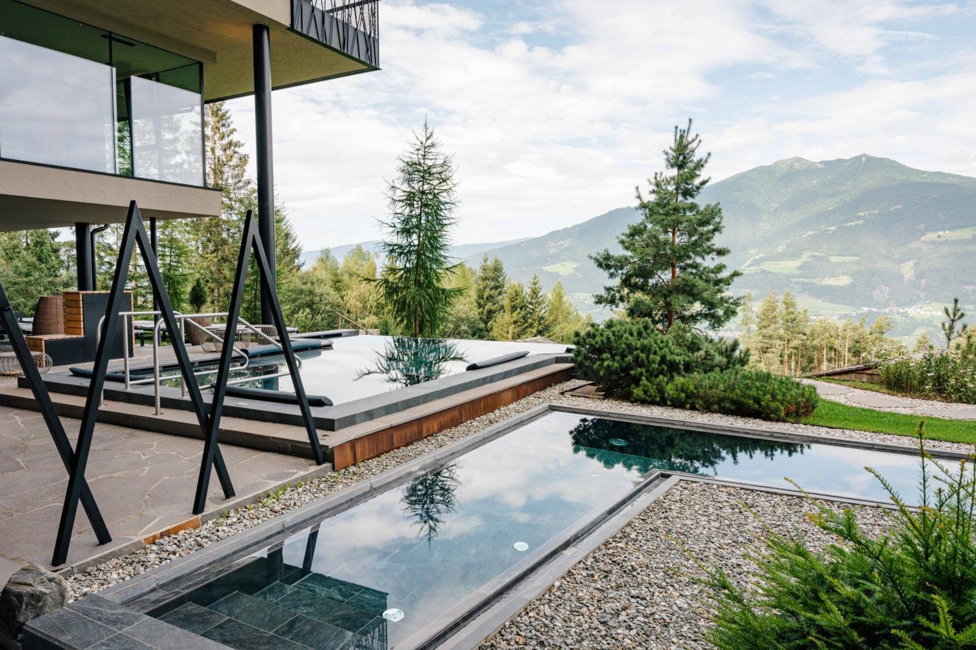 Hotel My Arbor - Dolomites Bressanone Esterno foto A private swimming pool in the Alps